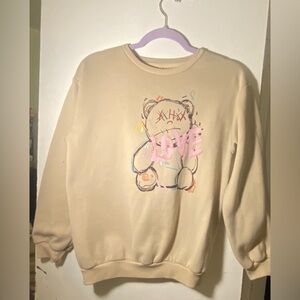 A beige bear love sweater